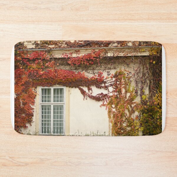 Item preview, the wall of an old house covered with creeper leafs autumn season Vienna  designed and sold by goceris.