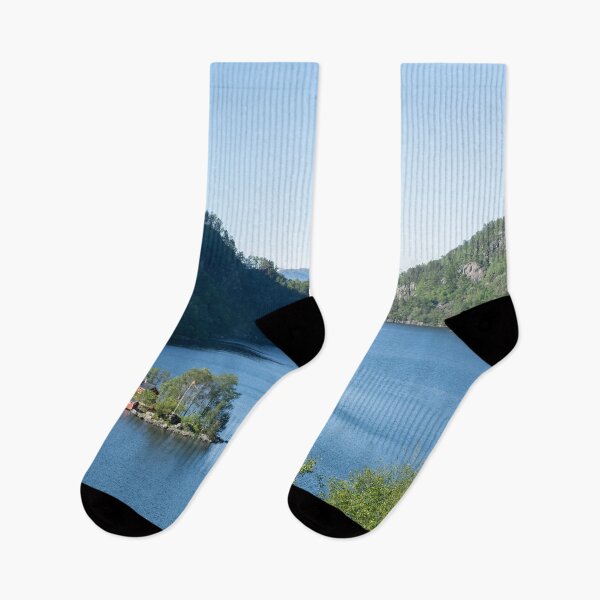 Item preview, Wonderful landscapes in Norway. Beautiful scenery of a island with a red house on the Lovrafjorden fjord. Mountains with snow in background. Sunny day designed and sold by Maurizio Fabbroni.