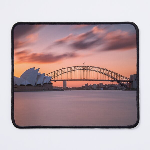 Item preview, Beautiful shot of the sydney harbor bridge with a light pink and blue sky designed and sold by klimov0101.
