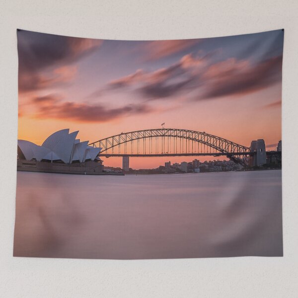 Item preview, Beautiful shot of the sydney harbor bridge with a light pink and blue sky designed and sold by klimov0101.