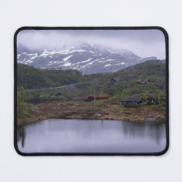 Item preview, Wonderful landscapes in Norway. Vestland. Beautiful scenery of houses with grass roof. Norwegian traditional architecture Mountains, trees and snow in background. Cloudy day designed and sold by Maurizio Fabbroni.