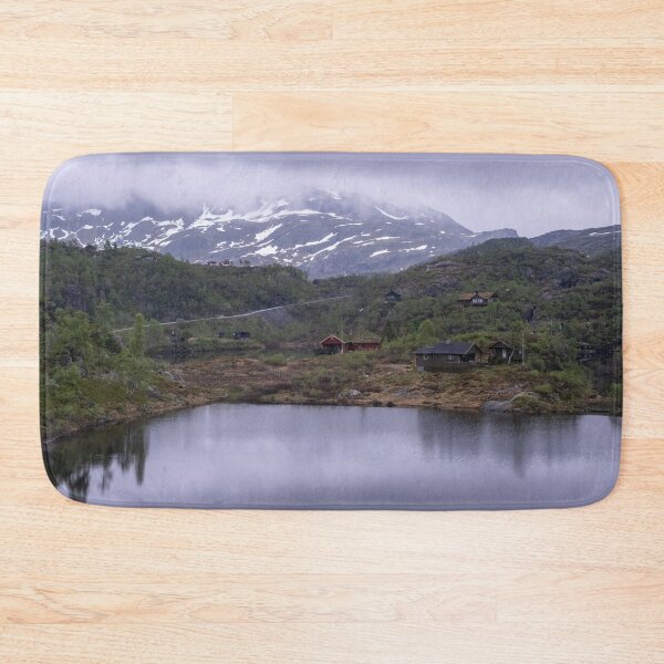 Item preview, Wonderful landscapes in Norway. Vestland. Beautiful scenery of houses with grass roof. Norwegian traditional architecture Mountains, trees and snow in background. Cloudy day designed and sold by Maurizio Fabbroni.