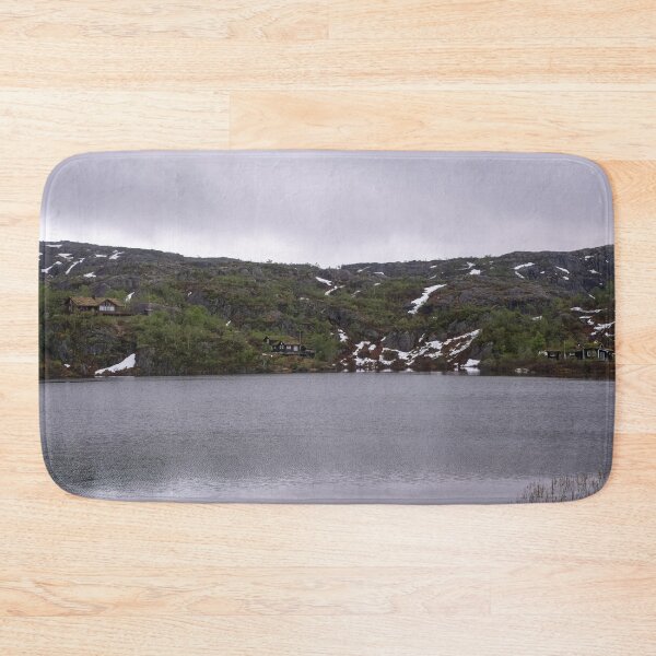Item preview, Wonderful landscapes in Norway. Vestland. Beautiful scenery of houses with grass roof. Norwegian traditional architecture Mountains, trees and snow in background. Cloudy day designed and sold by Maurizio Fabbroni.