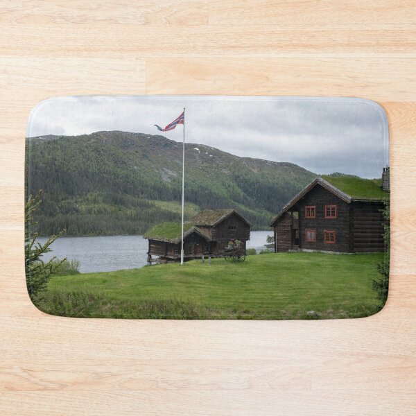 Item preview, Wonderful landscapes in Norway. Vestland. Beautiful scenery of houses with grass roof. Norwegian traditional architecture Mountains, trees and snow in background. Cloudy day designed and sold by Maurizio Fabbroni.