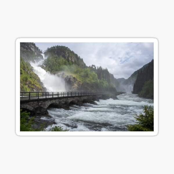 Item preview, Wonderful landscapes in Norway. Vestland. Beautiful scenery of Latefossen waterfall under the Lotevatnet lake on the Hardanger scenic route. Mountains, trees in background. Cloudy day designed and sold by Maurizio Fabbroni.