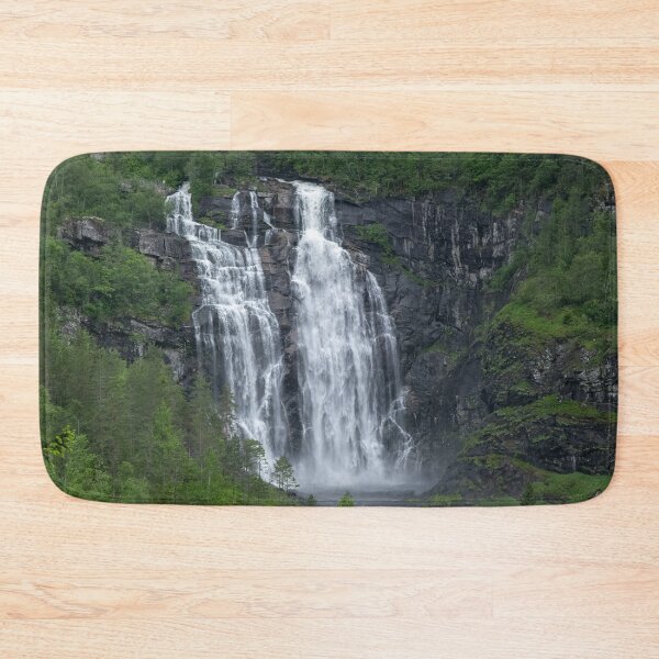 Item preview, Wonderful landscapes in Norway. Hordaland. Beautiful scenery of Skjervsfossen waterfall from the Storelvi river on the Hardanger scenic route. Mountains, trees in background. Rainy day designed and sold by Maurizio Fabbroni.