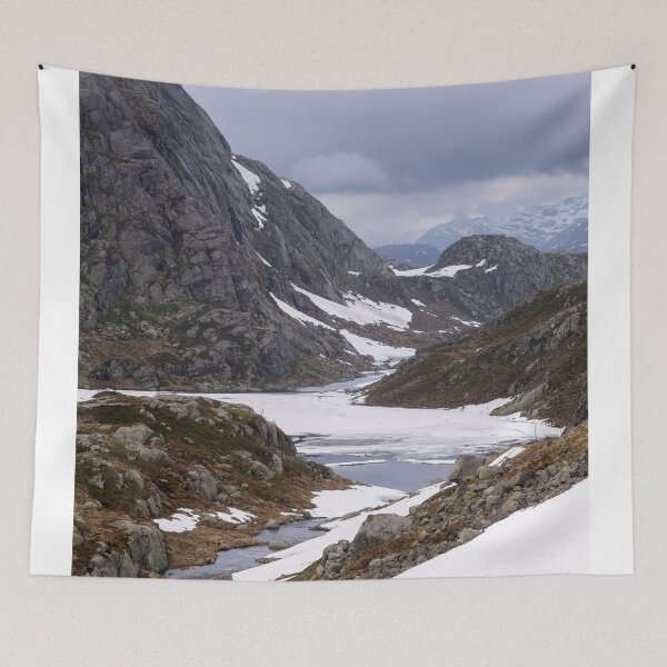 Item preview, Wonderful landscapes in Norway. Vestland. Beautiful scenery on the Ryfylke scenic route. Mountains, rocks and snow in background. Cloudy day (vertical) designed and sold by Maurizio Fabbroni.