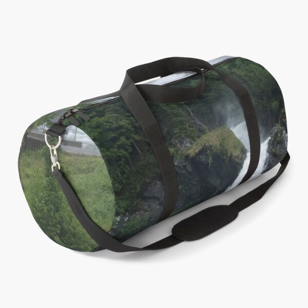 Item preview, Wonderful landscapes in Norway. Vestland. Beautiful scenery of  Steinsdalsfossen waterfall from the Fosselva river. Mountains, trees in background. Rainy day (vertical) designed and sold by Maurizio Fabbroni.