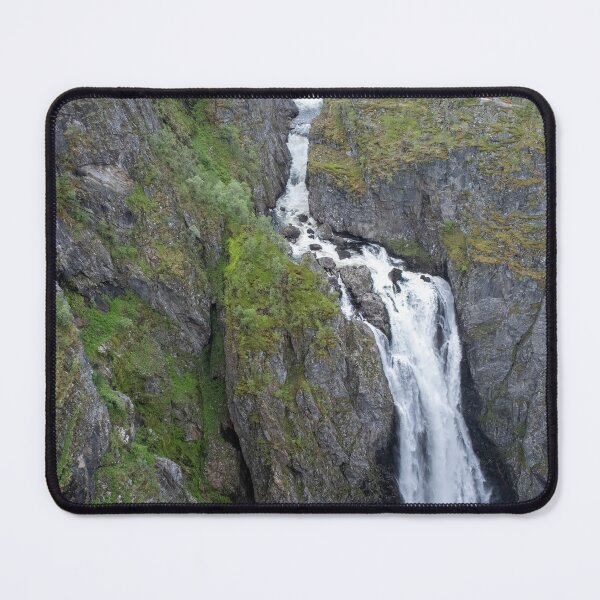 Item preview, Wonderful landscapes in Norway. Vestland. Beautiful scenery of Voringfossen waterfall in the Mabodalen valley on the Hardanger scenic route. Mountains, trees in background. Cloudy day (vertical) designed and sold by Maurizio Fabbroni.