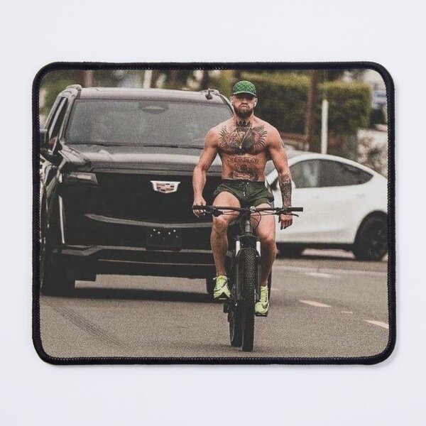 Item preview, Conor McGregor on a Bicycle T-Shirt designed and sold by CombatSport.