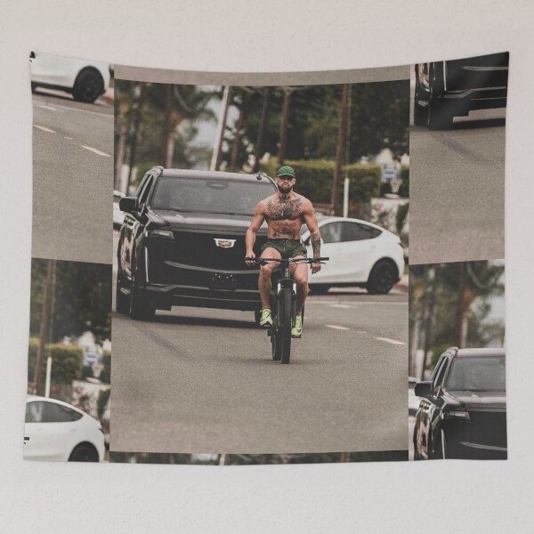 Item preview, Conor McGregor on a Bicycle T-Shirt designed and sold by CombatSport.