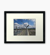 Barbed wire and sky Framed Print