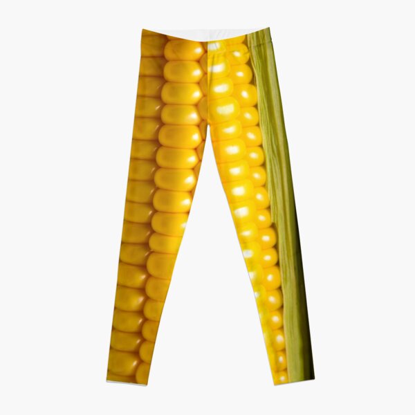 Three corn ears. Vegetable concept background Leggings