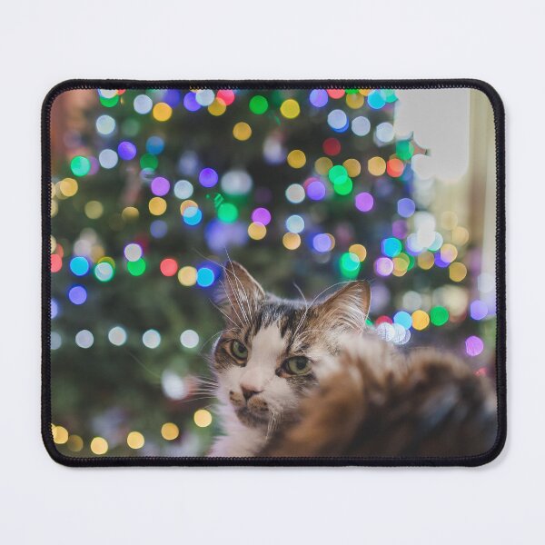 Item preview, Cat Sitting Infront Of Christmas Tree Lights Cutest Cat Pics designed and sold by CutestCatPics.