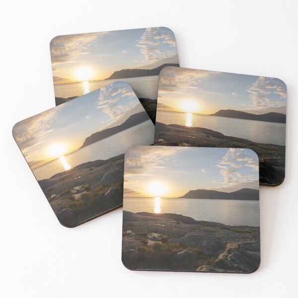 Item preview, Wonderful landscapes in Norway. Vestland. Beautiful scenery of a sunset on a calm sea in a sunny day with sunrays through the clouds and a fisherman on the shore. Yellow sky and rocks designed and sold by Maurizio Fabbroni.