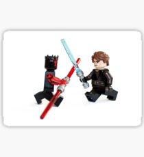 Lego Star Wars minifigure Anakin Skywalker and Darth Maul are fighting with sword isolated on white background. Sticker