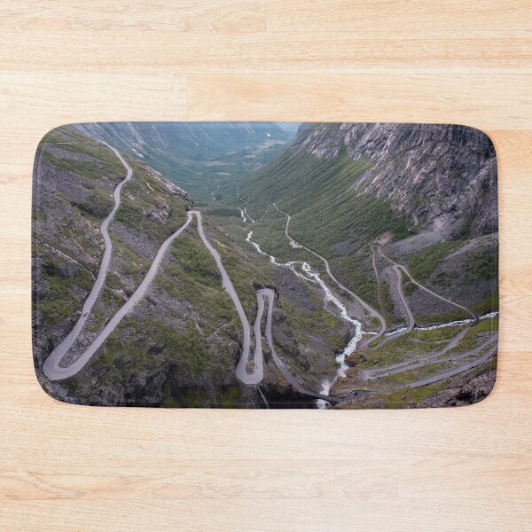 Item preview, Wonderful landscapes in Norway. Vestland. Beautiful scenery of Trollstigen winding roads and valley on the Geiranger Trollstigen scenic route at midnight sun. Snowed mountains, stream designed and sold by Maurizio Fabbroni.
