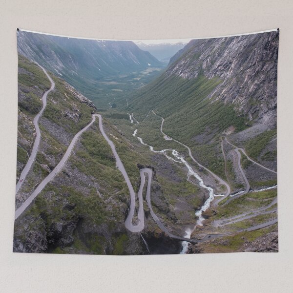 Item preview, Wonderful landscapes in Norway. Vestland. Beautiful scenery of Trollstigen winding roads and valley on the Geiranger Trollstigen scenic route at midnight sun. Snowed mountains, stream designed and sold by Maurizio Fabbroni.