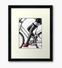 Sexy woman in red high heels and stockings riding bike art photo print Framed Print