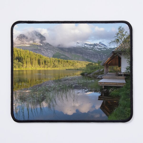 Item preview, Wonderful landscapes in Norway. Nordland. Beautiful scenery of Thaihuset in a mountain valley. It is idyllically situated by a calm water. Mountains and trees in background. Sunset. designed and sold by Maurizio Fabbroni.