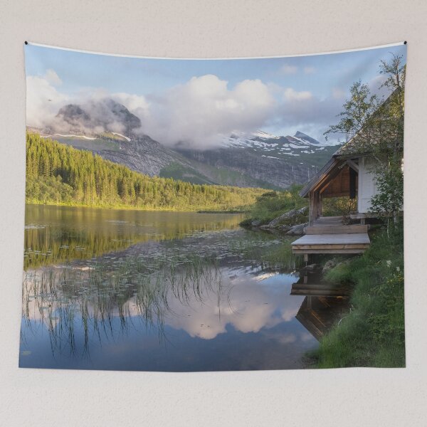 Item preview, Wonderful landscapes in Norway. Nordland. Beautiful scenery of Thaihuset in a mountain valley. It is idyllically situated by a calm water. Mountains and trees in background. Sunset. designed and sold by Maurizio Fabbroni.