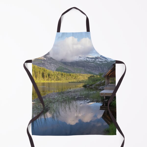 Item preview, Wonderful landscapes in Norway. Nordland. Beautiful scenery of Thaihuset in a mountain valley. It is idyllically situated by a calm water. Mountains and trees in background. Sunset. designed and sold by Maurizio Fabbroni.