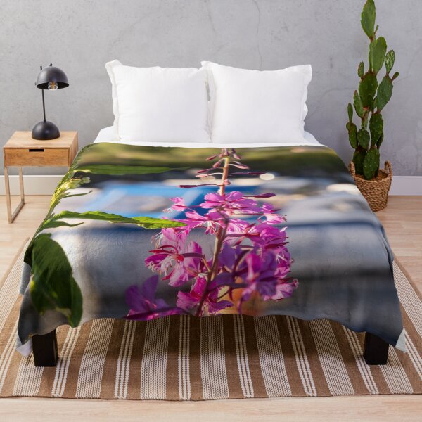 Item preview, Wonderful landscapes in Norway. Blooming colorful lupine flower in Norway in the wild grass. Blur harbour background with boats. Summer sunny day (vertical) designed and sold by Maurizio Fabbroni.