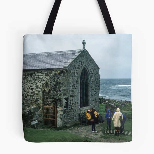 Item preview, People outside 1370 church in memory of St Cuthbert who died here 687 on Farne island off Sea Houses Bamburgh Northumberland England 19840528 0019m designed and sold by Fred Mitchell.