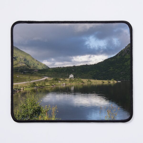 Item preview, Wonderful landscapes in Norway. Nordland. Beautiful scenery of a white house in a valley on the Lofoten Islands. Summer sunny day designed and sold by Maurizio Fabbroni.