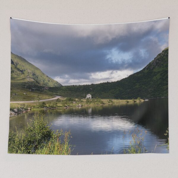 Item preview, Wonderful landscapes in Norway. Nordland. Beautiful scenery of a white house in a valley on the Lofoten Islands. Summer sunny day designed and sold by Maurizio Fabbroni.