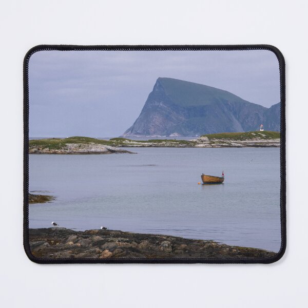 Item preview, Wonderful landscapes in Norway. Nordland. Beautiful scenery of a boat and a lighthouse on the Sommaroya island. Sea, seagulls and mountain in the background (vertical) designed and sold by Maurizio Fabbroni.