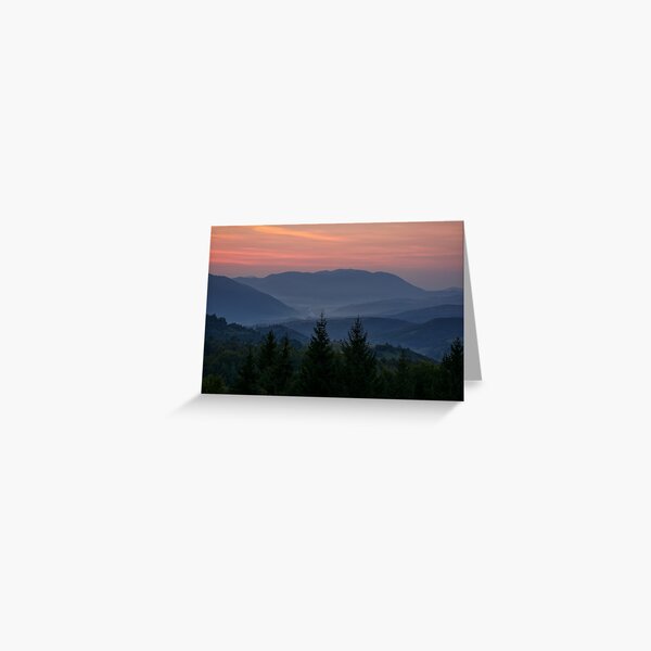 reddish sky at dawn in mountains Greeting Card