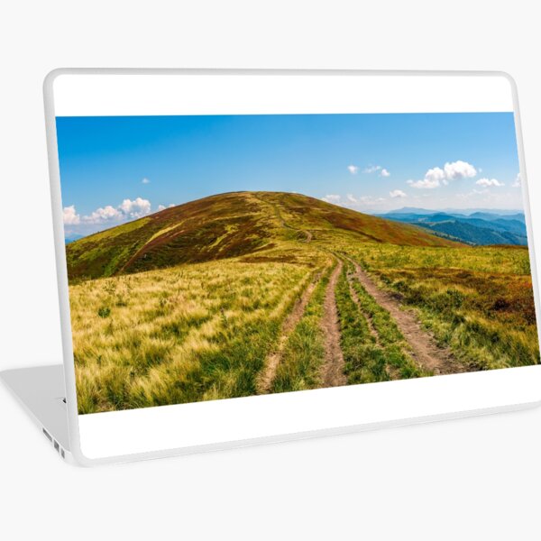 panorama with dirt road through mountain ridge Laptop Skin