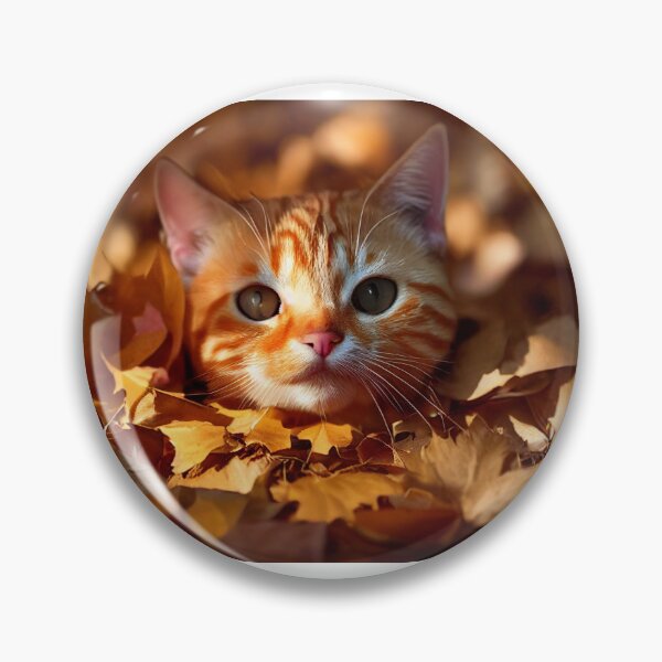 Item preview, Orange tabby cat peeking out of a pile of raked autumn leaves designed and sold by pnywest.