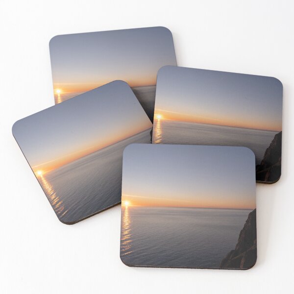 Item preview, Wonderful landscapes in Norway. Nord-Norge. Beautiful scenery of a midnight sun sunset at Nordkapp (Cape North). Boat and globe on a cliff. Rippled sea and clear orange sky. designed and sold by Maurizio Fabbroni.