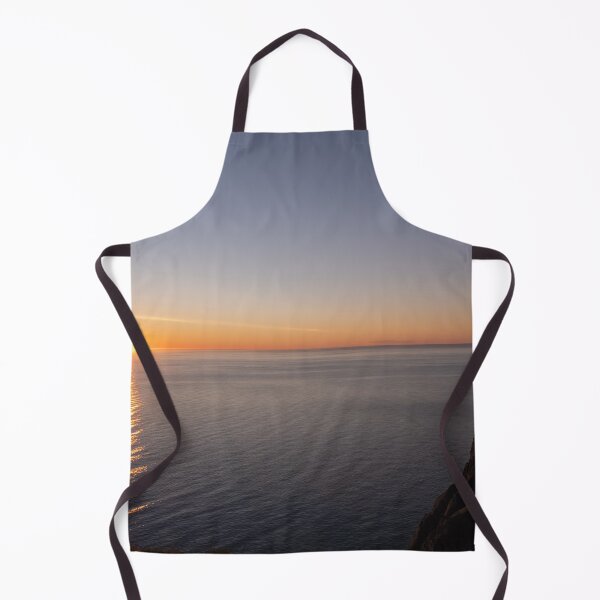 Item preview, Wonderful landscapes in Norway. Nord-Norge. Beautiful scenery of a midnight sun sunset at Nordkapp (Cape North). Boat and globe on a cliff. Rippled sea and clear orange sky. designed and sold by Maurizio Fabbroni.