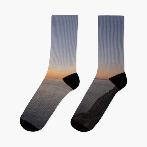 Item preview, Wonderful landscapes in Norway. Nord-Norge. Beautiful scenery of a midnight sun sunset at Nordkapp (Cape North). Boat and globe on a cliff. Rippled sea and clear orange sky. designed and sold by Maurizio Fabbroni.