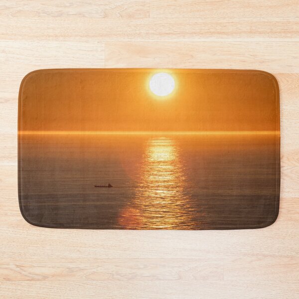 Item preview, Wonderful landscapes in Norway. Nord-Norge. Beautiful scenery of a midnight sun sunset at Nordkapp (Cape North). Boat and globe on a cliff. Rippled sea and clear orange sky.  designed and sold by Maurizio Fabbroni.