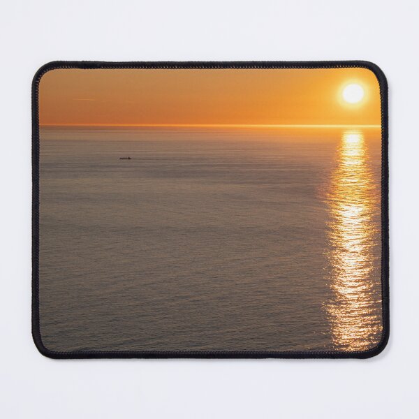 Item preview, Wonderful landscapes in Norway. Nord-Norge. Beautiful scenery of a midnight sun sunset at Nordkapp (Cape North). Boat and globe on a cliff. Rippled sea and clear orange sky.  designed and sold by Maurizio Fabbroni.