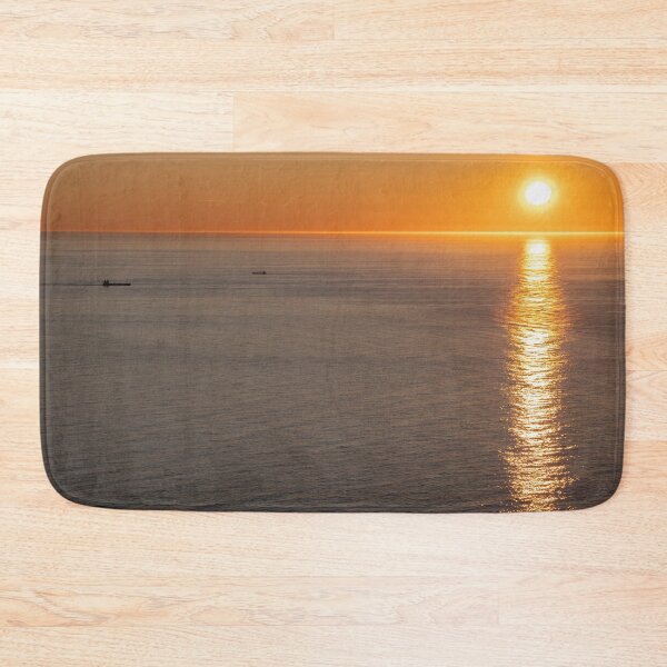 Item preview, Wonderful landscapes in Norway. Nord-Norge. Beautiful scenery of a midnight sun sunset at Nordkapp (Cape North). Boat and globe on a cliff. Rippled sea and clear orange sky.  designed and sold by Maurizio Fabbroni.