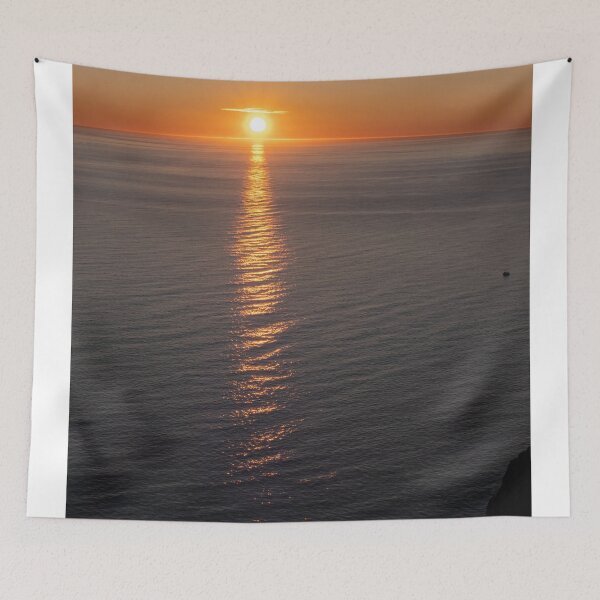Item preview, Wonderful landscapes in Norway. Nord-Norge. Beautiful scenery of a midnight sun sunset at Nordkapp (Cape North). Boat and globe on a cliff. Rippled sea and clear orange sky. (vertical) designed and sold by Maurizio Fabbroni.