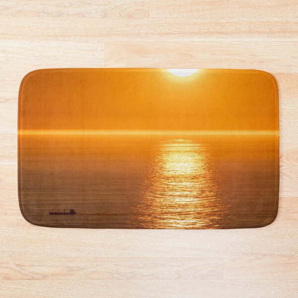 Item preview, Wonderful landscapes in Norway. Nord-Norge. Beautiful scenery of a midnight sun sunset at Nordkapp (Cape North). Boat and globe on a cliff. Rippled sea and clear orange sky. (vertical) designed and sold by Maurizio Fabbroni.