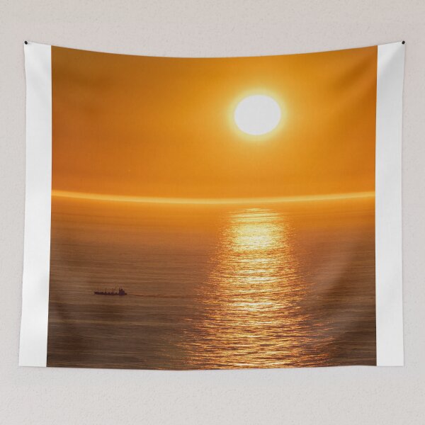 Item preview, Wonderful landscapes in Norway. Nord-Norge. Beautiful scenery of a midnight sun sunset at Nordkapp (Cape North). Boat and globe on a cliff. Rippled sea and clear orange sky. (vertical) designed and sold by Maurizio Fabbroni.