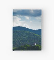 Afternoon light over church Hardcover Journal
