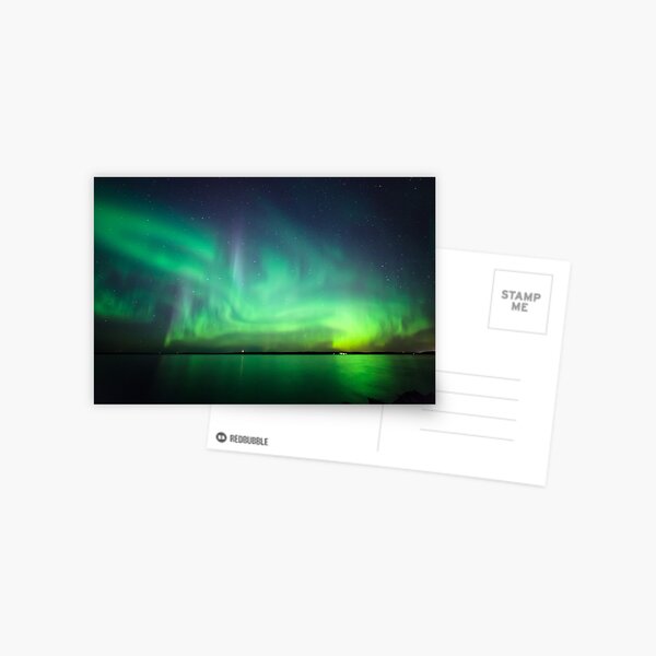 Northern lights over lake Postcard