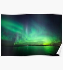 Northern lights over lake Poster