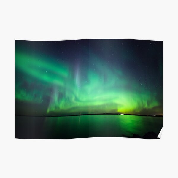 Northern lights over lake Poster