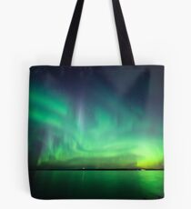 Northern lights over lake Tote Bag