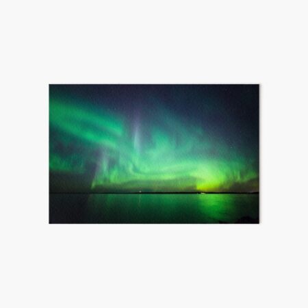 Northern lights over lake Art Board Print