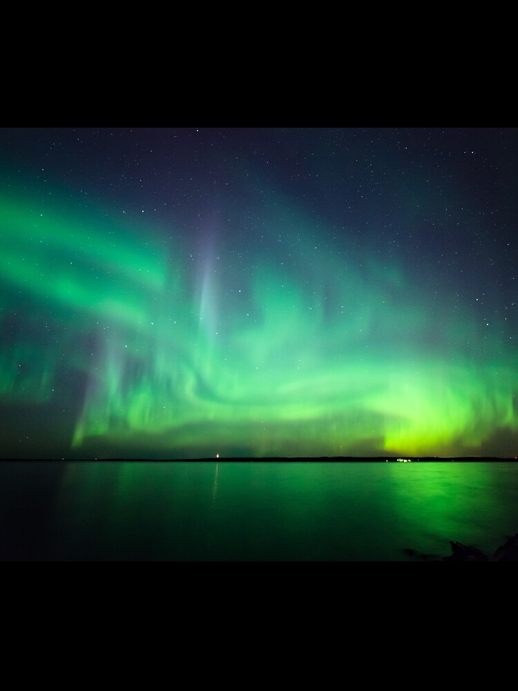 Northern lights over lake by Juhku